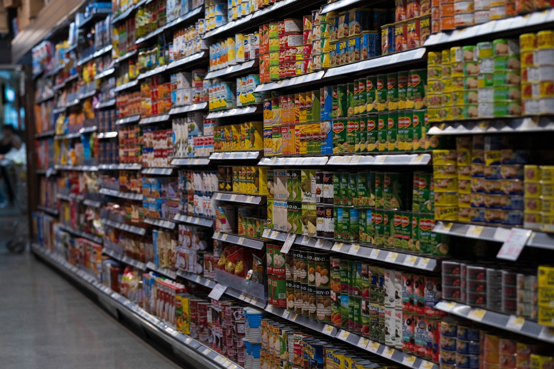 Well-merchandised retail shelves stocked with packaged goods